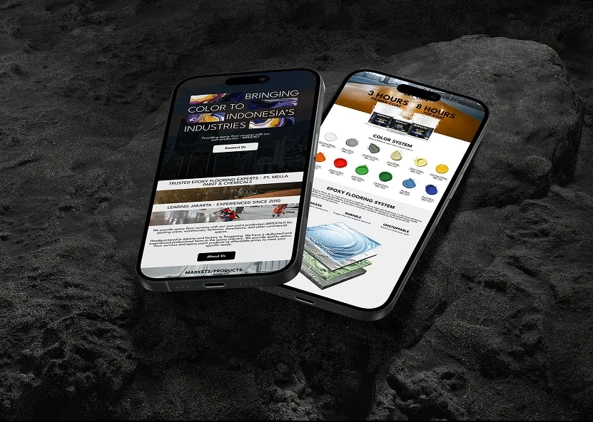 Two phone mockups of the Mella Paint website homepage over a dark rock texture background